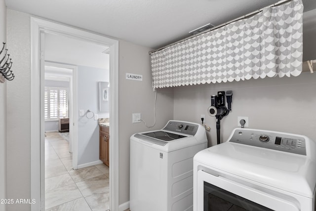 5755 W Harrison St, Chandler, AZ 85226 - laundry room featuring laundry area, washing machine and dryer, and baseboards