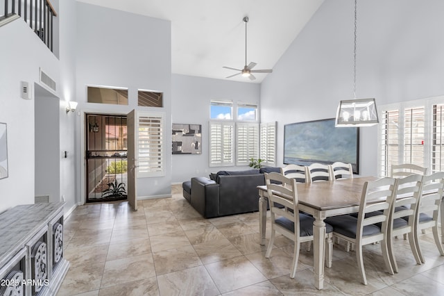 dining area with visible vents, high vaulted ceiling, and a ceiling fan