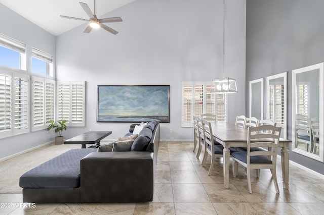 5755 W Harrison St, Chandler, AZ 85226 - living room with ceiling fan with notable chandelier, a high ceiling, and baseboards