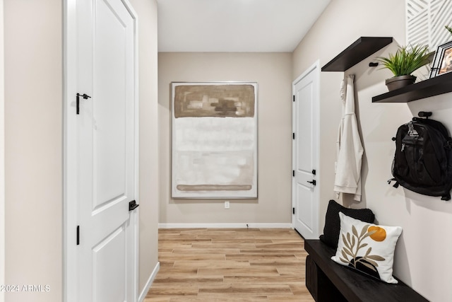 mudroom with light hardwood / wood-style floors