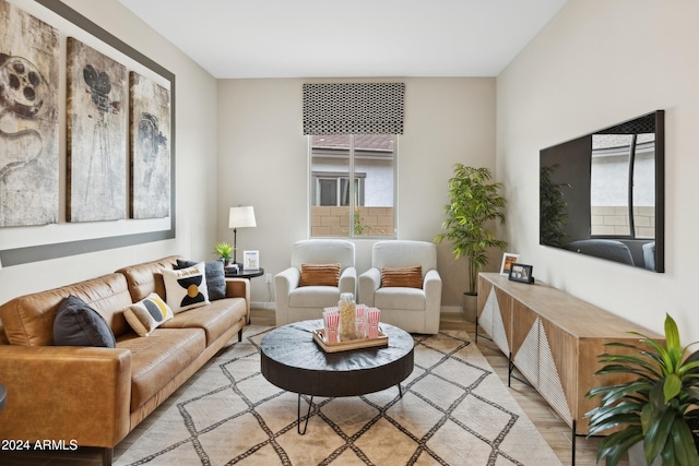 living room featuring light hardwood / wood-style floors and a wealth of natural light