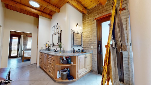 bathroom with tile floors, beam ceiling, vanity, and wood ceiling