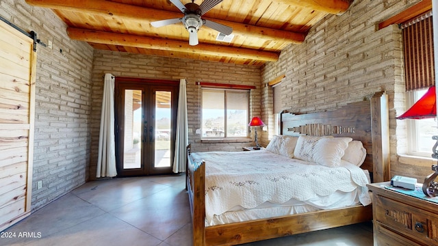 unfurnished bedroom featuring a barn door, ceiling fan, beam ceiling, and wood ceiling