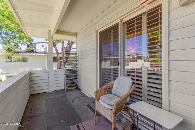 view of patio featuring a balcony