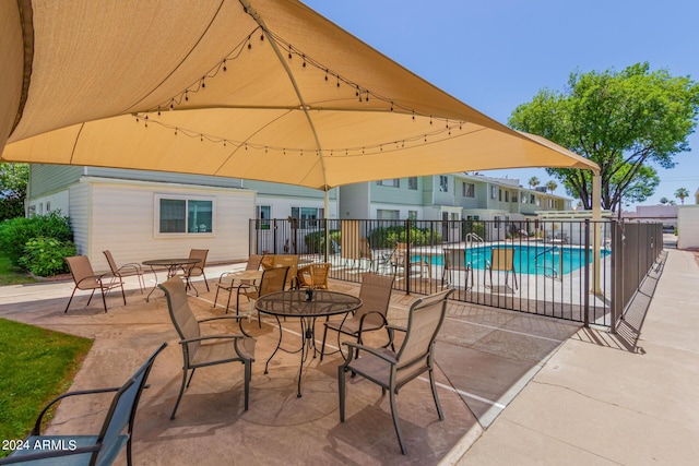 view of patio / terrace featuring a fenced in pool