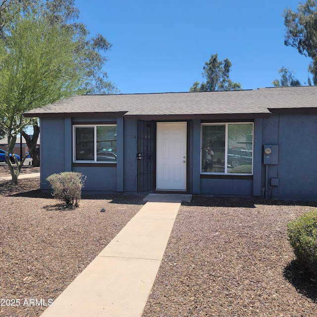 3645 N 69th Ave Unit 99, Phoenix, AZ 85033 - view of front of property with stucco siding and a shingled roof