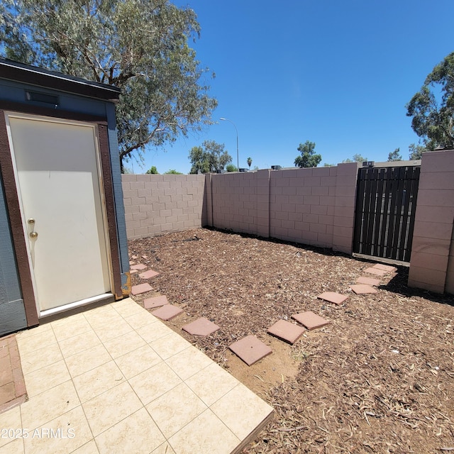 3645 N 69th Ave Unit 99, Phoenix, AZ 85033 - fenced backyard featuring a gate
