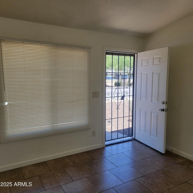 3645 N 69th Ave Unit 99, Phoenix, AZ 85033 - foyer entrance with baseboards