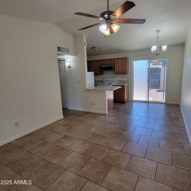3645 N 69th Ave Unit 99, Phoenix, AZ 85033 - kitchen featuring white range, stainless steel microwave, lofted ceiling, a ceiling fan, and a peninsula