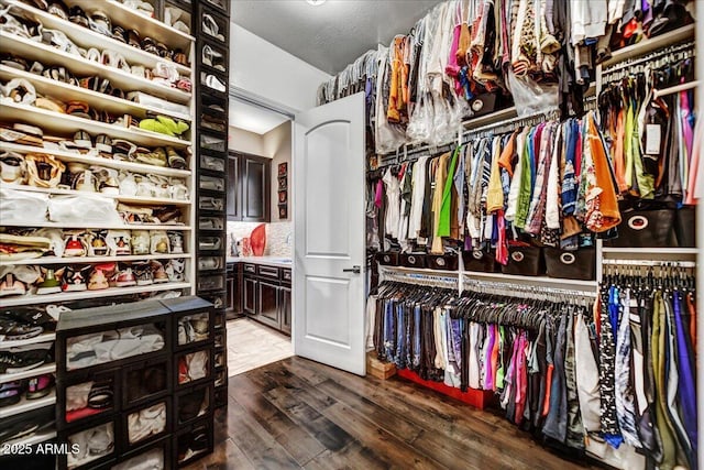 walk in closet featuring hardwood / wood-style floors