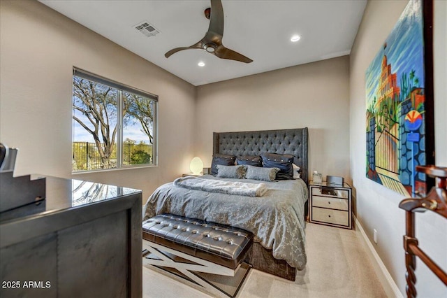 bedroom with ceiling fan and light carpet