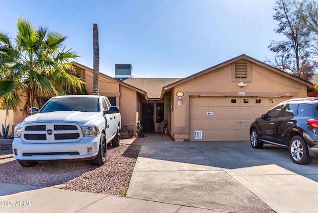 single story home with a garage and central AC