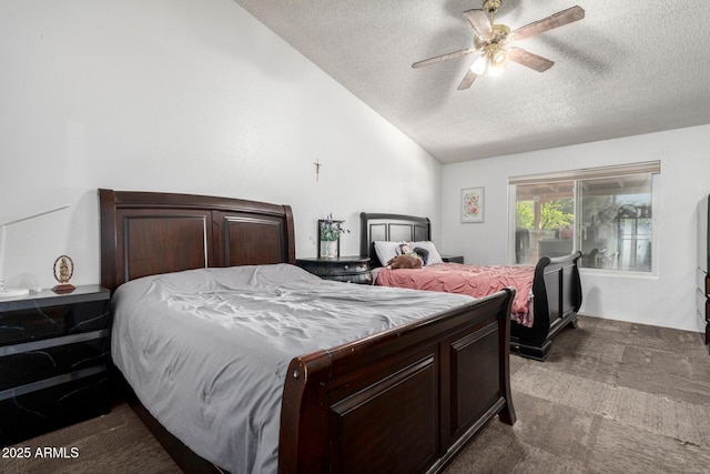 bedroom with a textured ceiling, ceiling fan, and vaulted ceiling