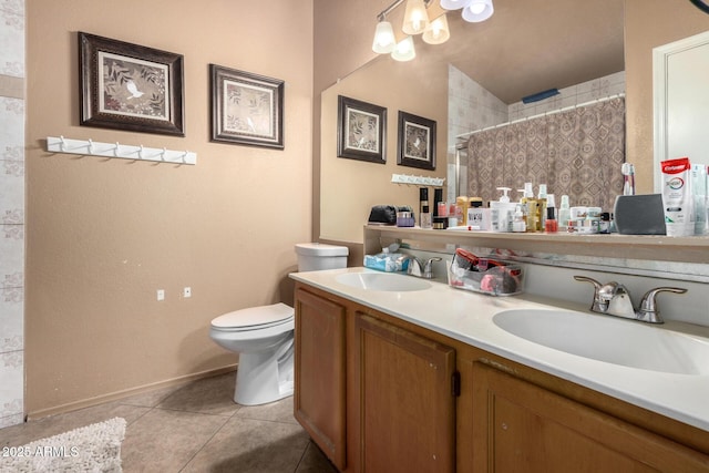 bathroom featuring curtained shower, tile patterned floors, vanity, and toilet