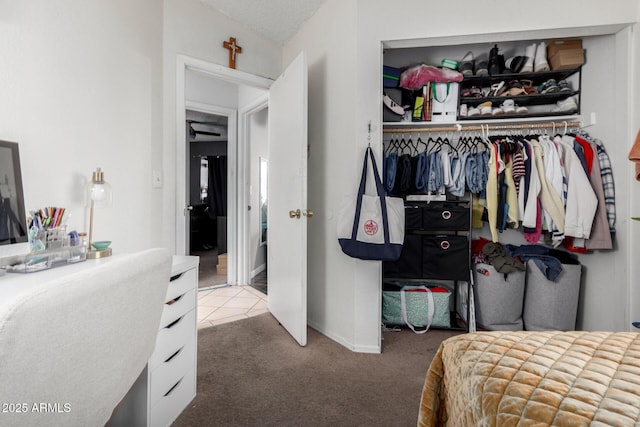 bedroom with a textured ceiling, a closet, and carpet