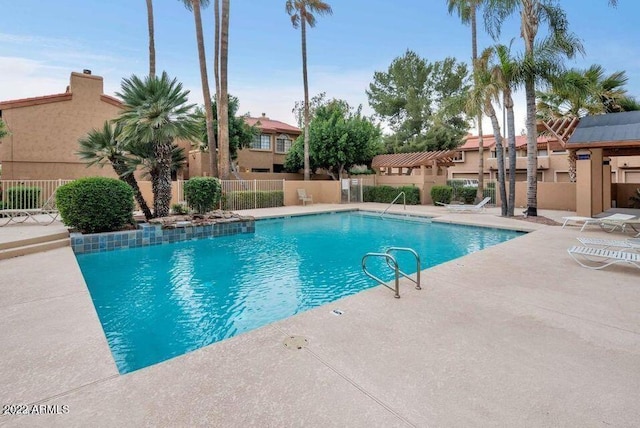 view of swimming pool featuring a patio