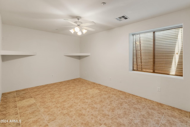 empty room featuring ceiling fan