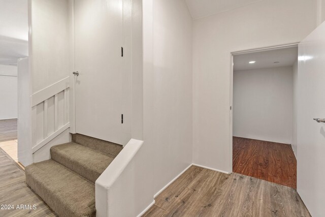 stairs with wood-type flooring