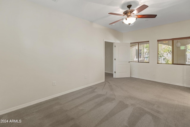 carpeted empty room with ceiling fan