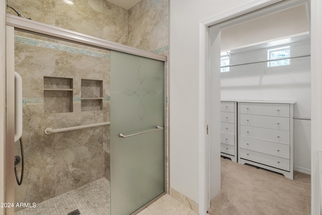 bathroom with a shower with shower door