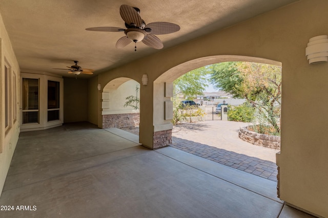 view of patio featuring ceiling fan