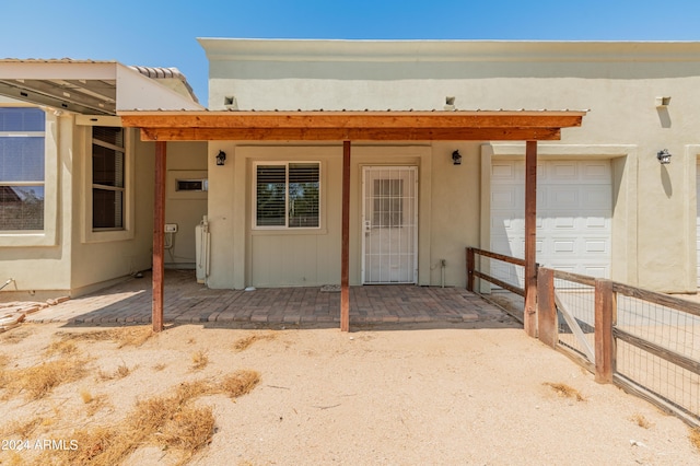 doorway to property featuring a garage