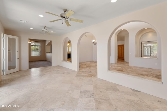 unfurnished room with ceiling fan