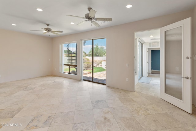 unfurnished room with ceiling fan