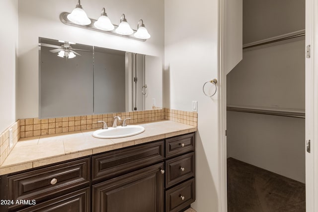 bathroom with ceiling fan and vanity