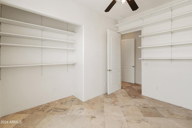 interior space featuring ceiling fan