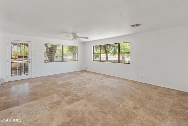 spare room with ceiling fan