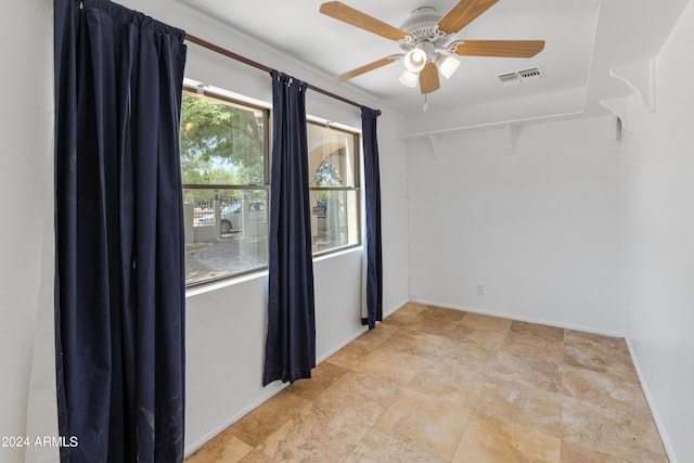 spare room featuring ceiling fan