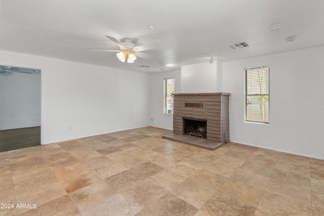 unfurnished living room featuring ceiling fan