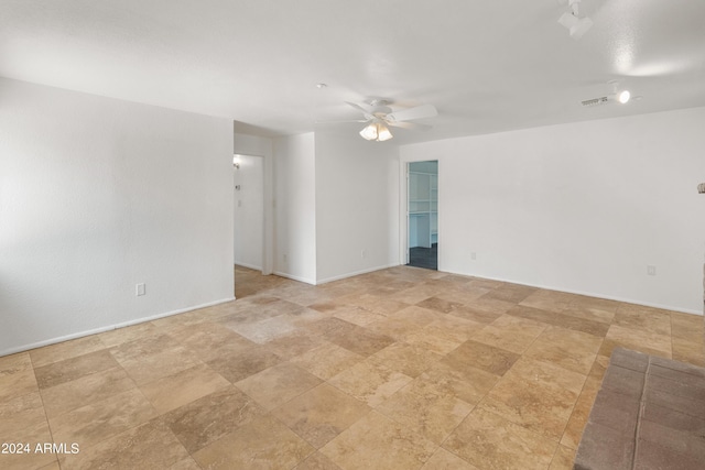 unfurnished room featuring ceiling fan