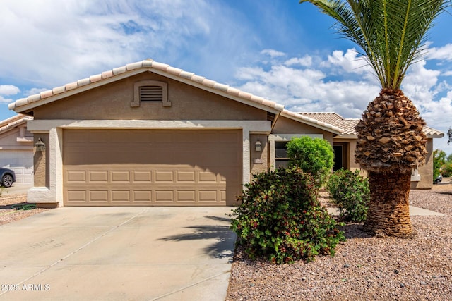ranch-style house with a garage, a tile roof, stucco siding, and driveway