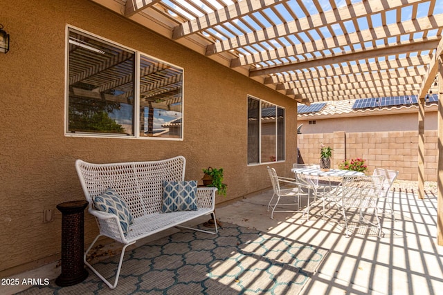view of patio / terrace with fence, outdoor dining area, and a pergola