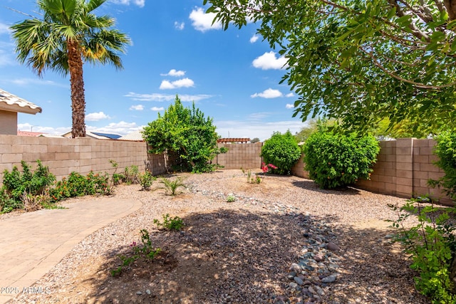 fenced backyard with a patio area