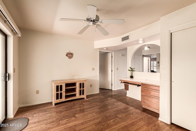 2105 S Zinnia Ave Unit 468, Mesa, AZ 85209 - kitchen with arched walkways, light countertops, dark wood finished floors, a ceiling fan, and healthy amount of natural light