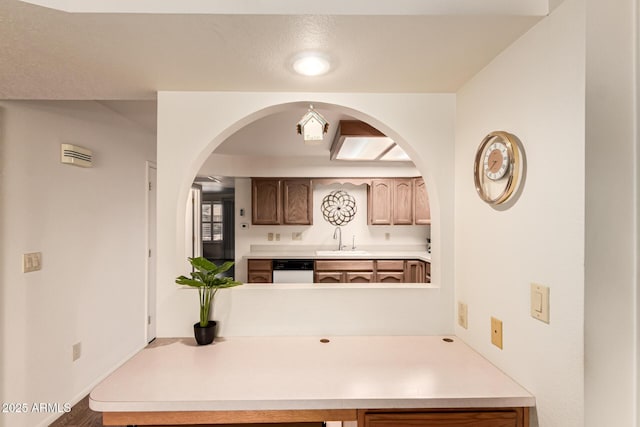 2105 S Zinnia Ave Unit 468, Mesa, AZ 85209 - kitchen with light countertops, arched walkways, and dishwasher