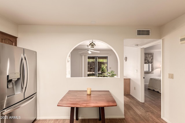 2105 S Zinnia Ave Unit 468, Mesa, AZ 85209 - dining space with light wood-style floors, ceiling fan, and arched walkways