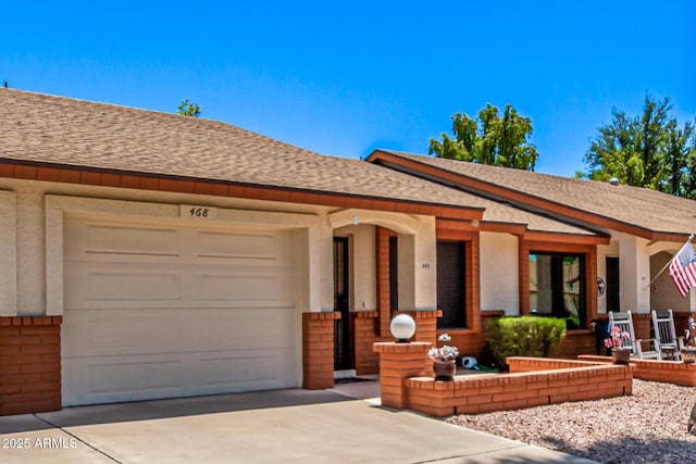 2105 S Zinnia Ave Unit 468, Mesa, AZ 85209 - view of front of property featuring roof with shingles, driveway, and a garage