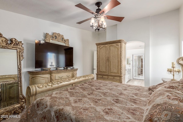 bedroom with ensuite bath and ceiling fan