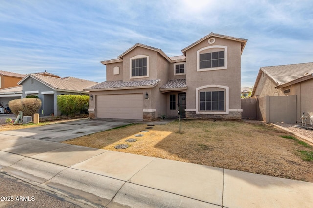 mediterranean / spanish house featuring a garage and a front lawn