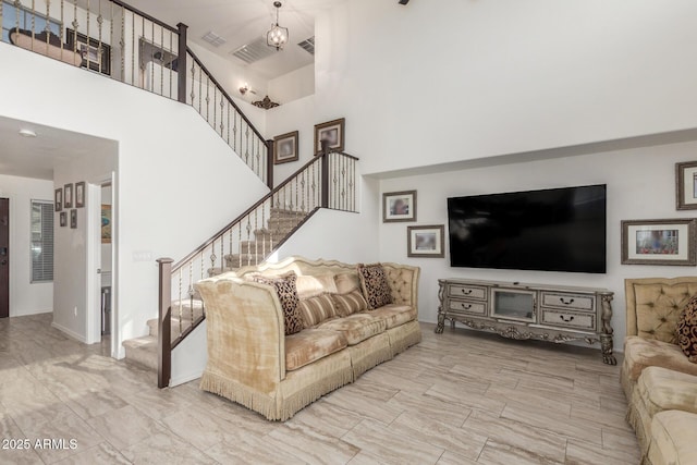 living room featuring a high ceiling