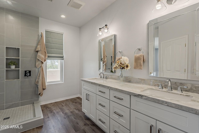 11752 N 135th Pl, Scottsdale, AZ 85259 - bathroom with wood finished floors, visible vents, a sink, and double vanity