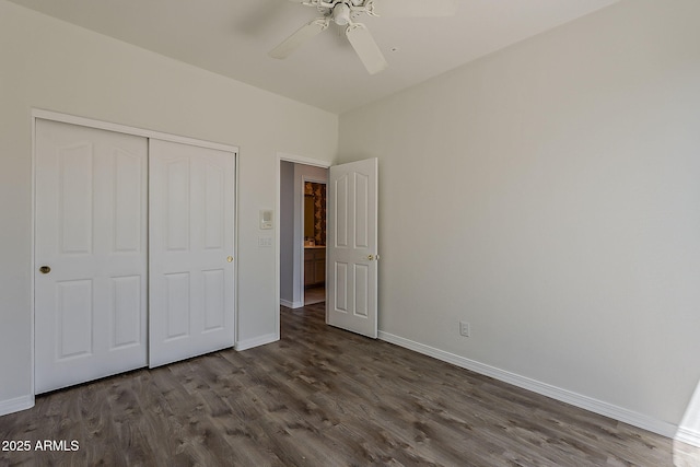 11752 N 135th Pl, Scottsdale, AZ 85259 - unfurnished bedroom featuring baseboards, a closet, and dark wood-style flooring