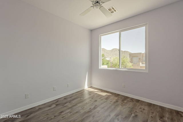 11752 N 135th Pl, Scottsdale, AZ 85259 - spare room with baseboards, wood finished floors, visible vents, and ceiling fan