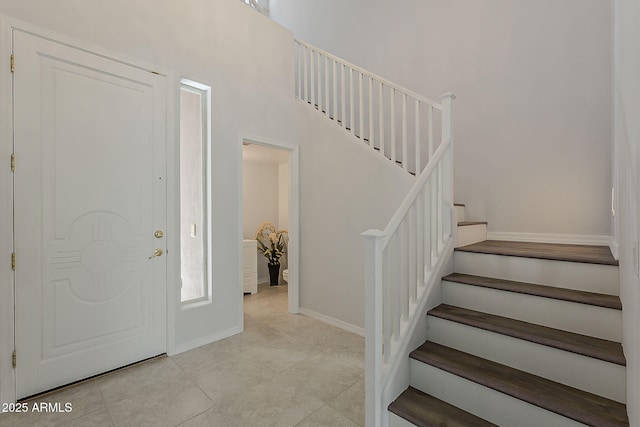 11752 N 135th Pl, Scottsdale, AZ 85259 - foyer with light tile patterned floors, baseboards, and stairway