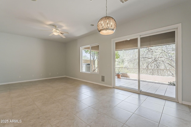11752 N 135th Pl, Scottsdale, AZ 85259 - spare room with light tile patterned floors, baseboards, and ceiling fan with notable chandelier