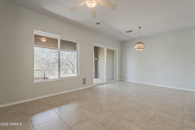 11752 N 135th Pl, Scottsdale, AZ 85259 - spare room featuring ceiling fan with notable chandelier, baseboards, visible vents, and light tile patterned flooring
